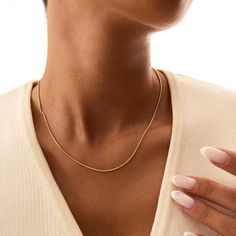 Elevate your style with the sleek and elegant 14K Real Solid Gold Snake Chain Necklace. This gold snake chain features a smooth, flat design that lays beautifully against the skin, offering a sophisticated and minimalist look. Perfect for layering or wearing alone, this dainty necklace adds a touch of luxury to any ensemble. Crafted from high-quality solid 14K gold, this herringbone necklace is both durable and timeless, making it an essential piece for any jewelry collection. Its versatile desi Gold Snake Chain, Layered Chain, Herringbone Necklace, Snake Chain Necklace, Layered Chains, Everyday Necklace, Gold Snake, Necklace Dainty, Dainty Necklace