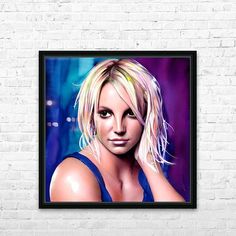 a painting of a woman with blonde hair and blue eyes is hanging on a white brick wall