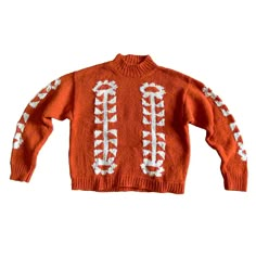 an orange sweater with white stitches on it