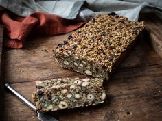 a wooden cutting board topped with granola bars