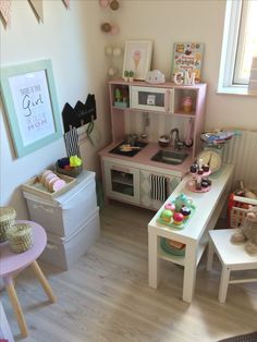 a child's play room with toys and decor