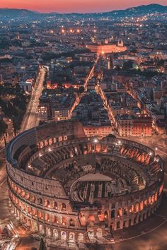 an aerial view of the roman colossion in rome, italy at night time