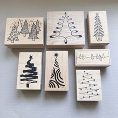 six rubber stamps with christmas trees on them