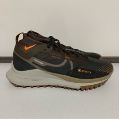 Nike React Pegasus Trail 4 Gore-Tex Sneaker Running Shoes -Size 6 Men’s (7.5 Women’s) -Anthracite/Light Mandarin/Iron Stone -Hit The Ground Running -Low-Profile Design -Pull Tab For Easy Entry -Lace-Up Fastening -Sock-Like Cuff -Signature Nike Branding -React Foam Midsole Provides Ultra-Responsive, Springy Cushioning -Durable Rubber Outsole -Shockwave-Like Pattern Tread -New With Tags -New Without Box Functional Brown Running Shoes With Round Toe, Hiking Sneakers With Air Max Cushioning And Round Toe, Hiking Sneakers With Air Max Cushioning, Nike Trail Running Shoes With Round Toe, Brown Low-top Running Shoes For Outdoor Activities, Brown Low-top Running Shoes For Outdoor, Nike Trail Running Sneakers With Round Toe, Nike Low-top Hiking Boots With Vibram Sole, Brown Low-top Running Shoes With Air Max Cushioning