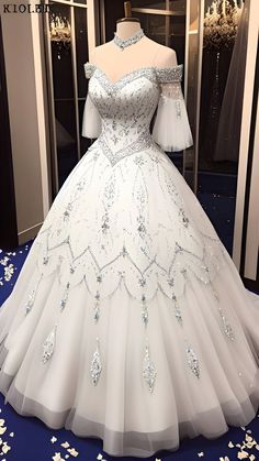 a white ball gown on display in a store