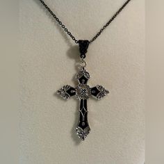 Unisex Women Men Black And Silver Tone Cross Pendant Necklace. Lovely Black And Silver Tone Cross Pendant On A Black Necklace, Perfect Addition To Your Necklace Collection. Looks Great With Simple Or Fancy Outfits. *Brand New. *Necklace Length: 50cm. *Necklace Material: Stainless Steel. *Necklace Color: Black. *Cross Size: 5.5cm X 3.7cm. *Cross Material : Zinc Alloy. *Will Ship Next Day Or Same Day If Possible. *Make A Bundle Of 2 Or More Items And Save $2 (Message Me First!) #Gothicnecklace#Rel Necklaces With Crosses, Gothic Black Necklace With Silver Chain, Elegant Black Cross Necklace Gift, Black Cross Pendant Jewelry With Silver Chain, Black Sterling Silver Cross Necklace For Gift, Black Nickel-free Cross Pendant Jewelry, Black Metal Cross Necklace As Gift, Cross Necklace Black, Cross Gothic