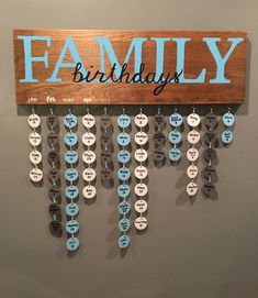 a wooden sign hanging from the side of a wall that says, family on it