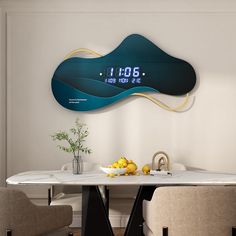 a table with two chairs and a clock on the wall above it that reads 1 00