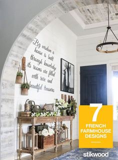 an archway leading into a living room with plants on the table and potted plants