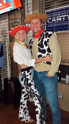 a man and woman dressed in cowgirl costumes