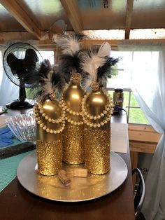 a gold crown sitting on top of a table next to a fan and other items