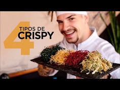 a man holding a tray with different types of food on it and the words tips de crispy in front of him