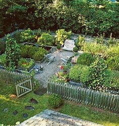 an aerial view of a backyard garden with wooden benches and various types of plants in it