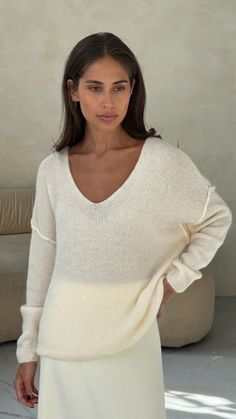 Hailey sweater is a classic off duty knit. This subtle v-neck sweater in a simple relaxed fit is the epitome of modern chic. Easy to style with a super lightweight feel taking you into Spring as the perfect layering staple. Composed of a soft fluffy wool blend - elevating simplicity. Details and Fit Soft Fluffy Wool Blend Hand Wash Setting One Size - Relaxed Fit. Fits UK Size 8-14 Lera is 5ft7 (170cm) UK Size 8 Colour: Ivory Made in Italy Layering Essentials, Uk Weather, A Perfect Circle, Modern Wardrobe, Polo Sweater, Modern Chic, Everyday Wardrobe, V Neck Sweater, Off Duty