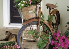 an old bicycle with flowers in the basket