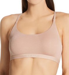 No wires, no adjustments, no hassle. This super soft bralette is just what you need for a comfortable fit that will keep you supported. Wireless bralette has an additional layer of soft knit for more coverage. Super soft modal knit has ribbed texture. Covered elastic along the scoop neckline keeps fit close. Sewn-on elastic underband has Calvin Klein logo at center front. Striped elastic straps have restricted stretch and do not adjust. Straps connect at center back to form a racerback for a spo Ribbed Texture, Wireless Bra, Keep Fit, Calvin Klein Woman, Sporty Look, Soft Knits, Scoop Neckline, Pullover Styling, Bralette