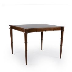 a wooden table sitting on top of a white floor