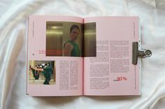 an open pink book with pictures on it