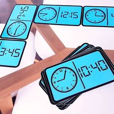 a clock and time cards sitting on top of a table