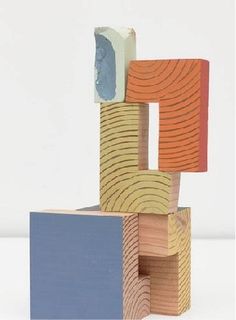 an abstract sculpture made out of wooden blocks