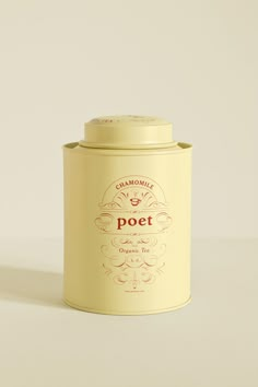 a canister with the lid open on a white surface