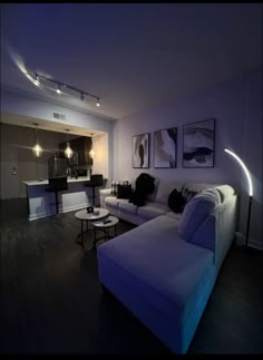 a living room filled with furniture and lights