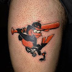 a baseball player with a bat and helmet on his knee is depicted in this tattoo design