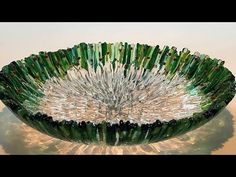 a glass bowl that is sitting on a table