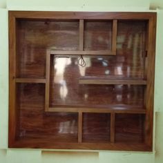 a wooden shelf with several compartments in it