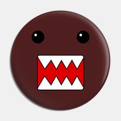 a red button with white teeth and big eyes