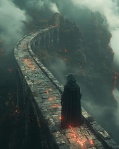 a man standing on top of a stone bridge in the middle of a foggy sky