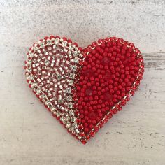 This Love red&silver heart brooch is an excellent addition to the basic wardrobe. Like all basic things, it's combined with many items, whether it's a sweater, jacket, coat, dress, hat, cap or even a bag. Materials: - Czech beads; - crystals; - metal clasp; - chamois-leather Measurements: This item is around 55mm in diameter and its weight is 7 gr. The photograph is real, but it cannot convey the beauty of the decoration. By placing an order, you will receive this very brooch. If you have any additional questions - don't hesitate to contact me. Head back to my shop here  https://www.etsy.com/shop/Bulavochka Red Brooch, Wire Ornaments, Felt Beads, Mexican Crafts, Heart Pin, Felt Brooch, Heart Crafts, Heart Brooch, Gift Love