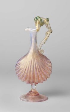 a glass vase with a woman's dress on it