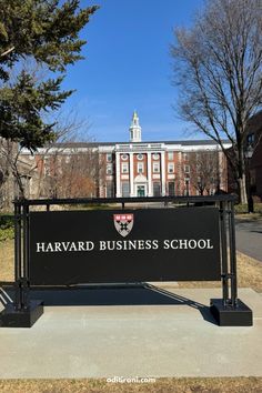 the harvard business school sign in front of an old brick building