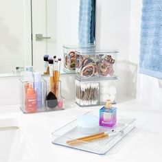 a bathroom counter with various items on it