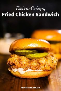 fried chicken sandwich on a wooden table with text overlay that reads extra crispy fried chicken sandwich