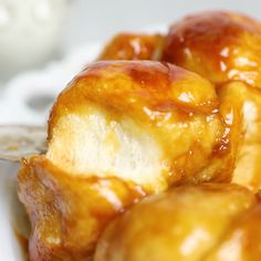 a close up of some kind of food on a white plate with a spoon in it