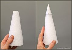 a hand holding a white cone shaped object