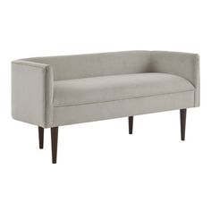 a gray couch sitting on top of a white floor