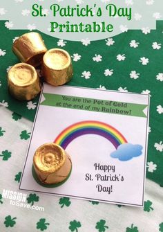 there is a card and some gold coins on the table with shamrocks around it