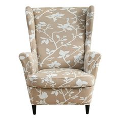 an upholstered chair with white flowers and leaves on the back, against a white background