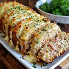 a white plate topped with meat covered in cheese