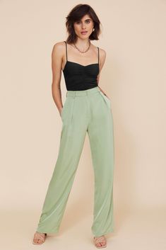 DETAILS Fuss-free trousers that are as trendy as they are comfy. The Andie flared pants have a glossy satin finish, and it’s a versatile piece that can be dressed up or down depending on the occasion. Length: Long Easy fit Unlined Belt loops included Front button Side pockets Color: Sage GreenComposition: Polyester SIZE & FIT Full Size Guide Model wears a AU 8 / US 4 / Size S Height: 173cm / 5'8'' Bust: 84cm / 33'' Waist: 64cm / 25'' Hips: 89cm / 35'' *** PLEASE NOTE*** The Lakeyo clothing range runs half a size smaller than standard AU clothing sizes, please consider the size before purchase, thank you! Sleek Satin Wide Leg Pants, Evening Viscose Trousers, Viscose Evening Trousers, Chic Evening Bottoms In Viscose, Chic Evening Pants In Viscose, Sleek Satin Pants, Chic Green Satin Bottoms, Spring Satin Straight Leg Pants, Chic Silk Pants For Night Out