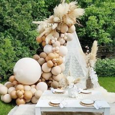 a table topped with lots of balloons and flowers