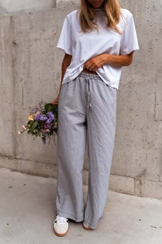 Grey striped pajama-style, wide-leg pants/trousers that feature an elastic waist in addition to a bow to tie. These comfortable pants can be worn low rise if that suits your style, they also do not offer lining but they are not sheer. Our model also wears the White Jane T-Shirt. One size (fits from US 2-4-6-8) Length 39.37 in - Width 12.60 in 80% Cotton - 20% Polyester Washing: 86°F handwash Comfy Linen Pants Outfit, Grey Linen Pants Outfit, Striped Trousers Outfit, Striped Pants Outfit, Linen Striped Pants, Linen Trousers Outfit, Linen Pants Outfit Summer, Worship Outfits