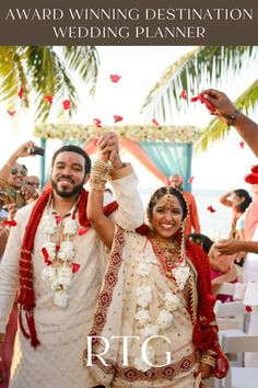 a man and woman are walking down the aisle with confetti in their hands