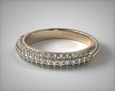 a wedding band with three rows of diamonds