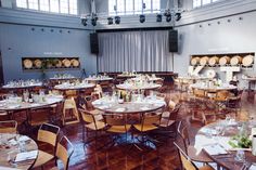 a large room filled with lots of tables and chairs