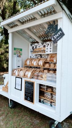 a white food cart with bread on it