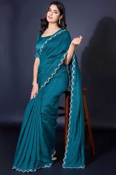 Elevate your elegance with this Designer Khadi Shimmer Saree, a perfect blend of traditional charm and modern allure. Crafted from luxurious Khadi Shimmer fabric, this saree features exquisite border work that gracefully frames the drape, adding a touch of sophistication to every pleat. The matching blouse, also in Khadi Shimmer, complements the saree for a seamless, radiant look. Slight color variations may occur due to digital imaging. Accessories shown are for styling purposes only and not in Lehenga Suit, Shimmer Fabric